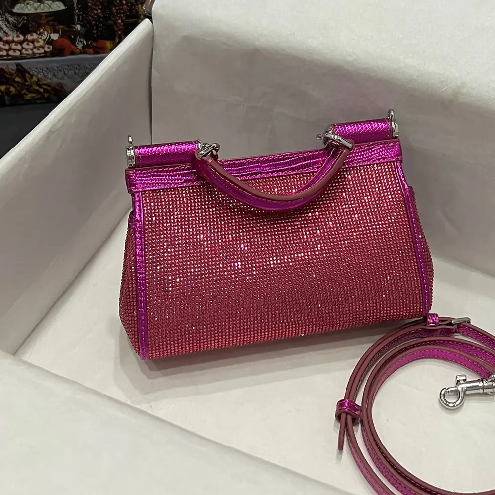 Side profile showing structured silhouette of Small Sicily Handbag in rose