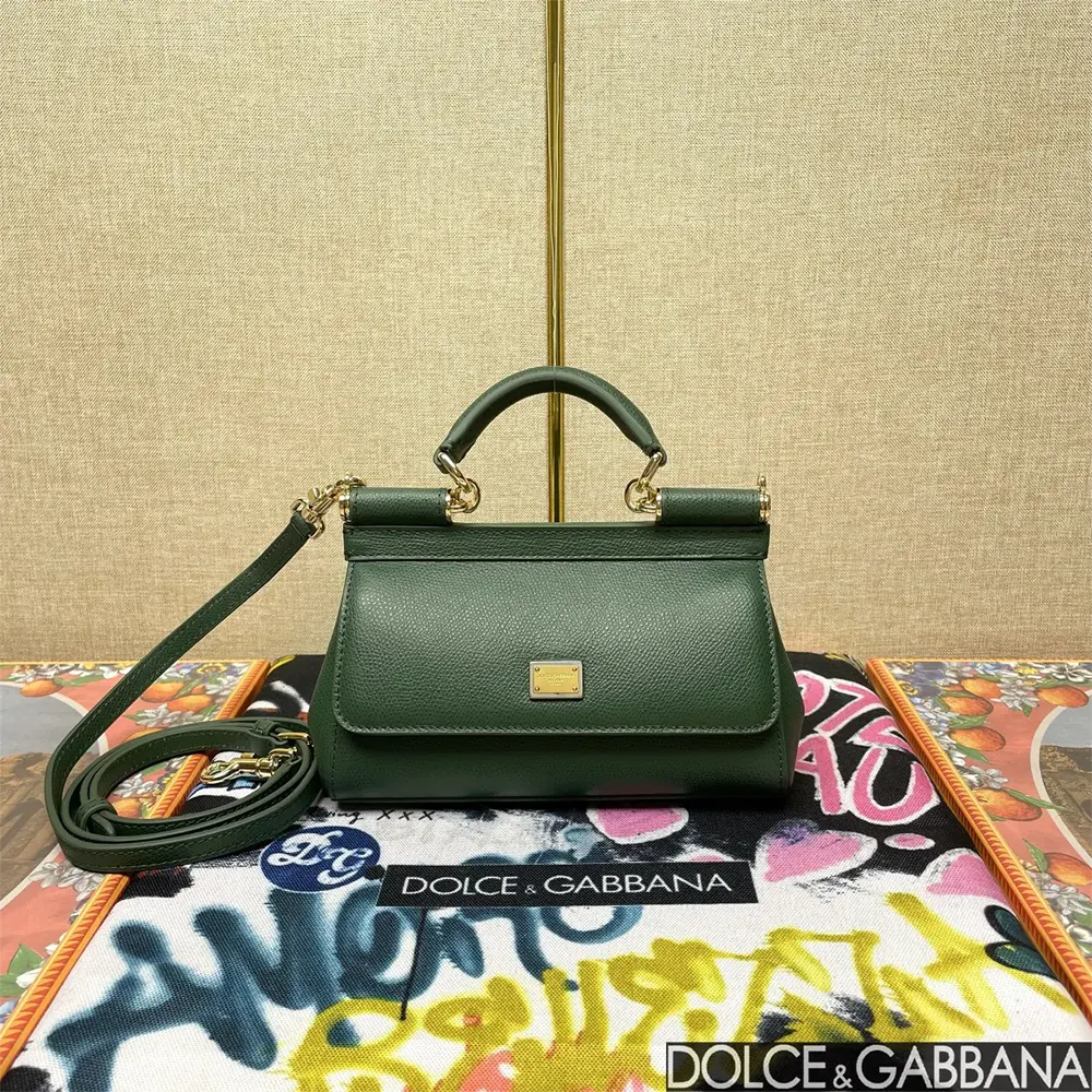 Close-up of gold D&G plaque on green leather Small Sicily Handbag