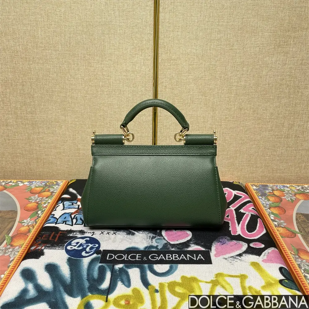 Side profile showing silhouette and strap of Small Sicily Handbag-Green