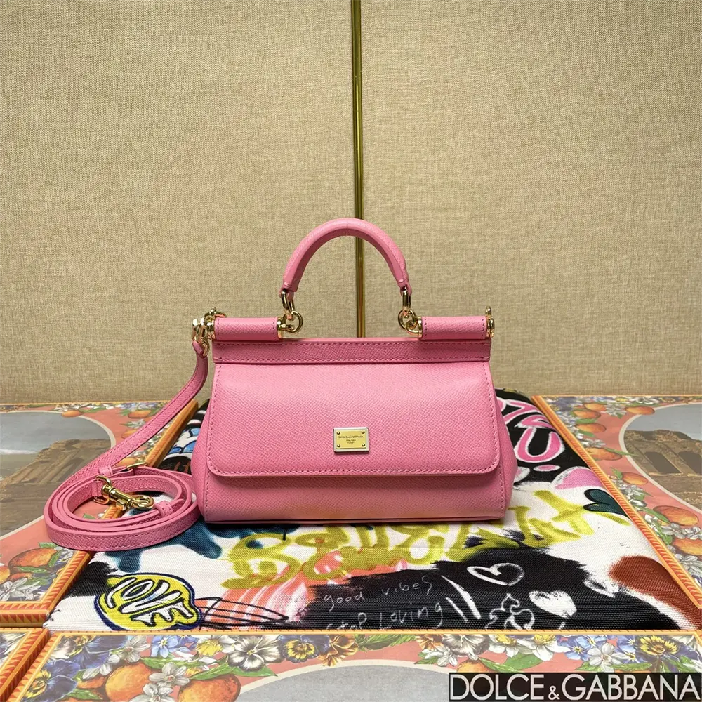 Close-up on gold-tone hardware of Small Sicily Handbag by Dolce Gabbana D&G