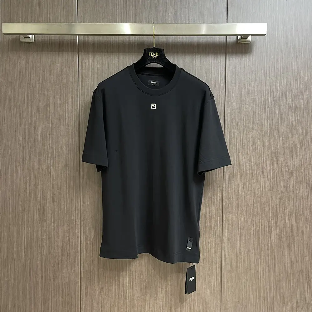 Close-up of Fendi logo and fabric texture on Black Cotton T-shirt