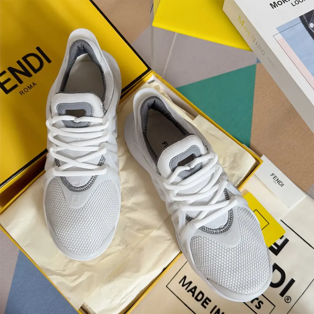 Close-up on mesh texture and Fendi logo tag on sneakers