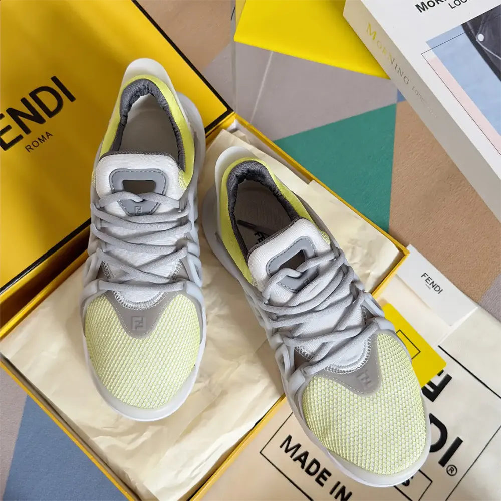 Back angle highlighting heel and Fendi logo on yellow mesh sneakers