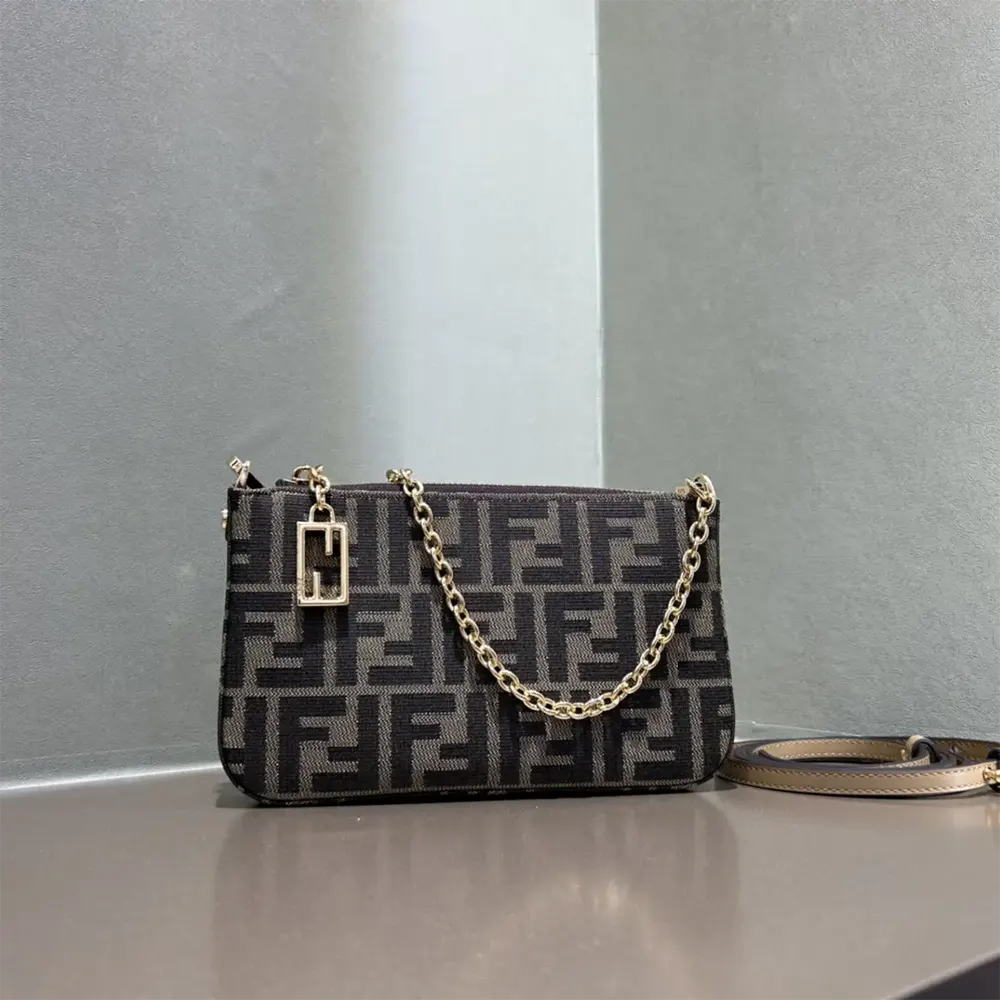 Side angle showing silhouette and texture of Fendi Women Baguette Pouch Brown Jacquard