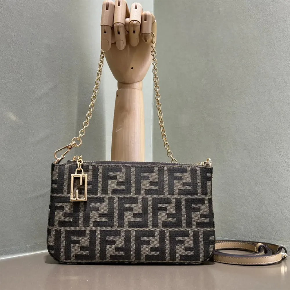 Close-up of gold-tone chain and FF logo on Fendi Women Baguette Pouch