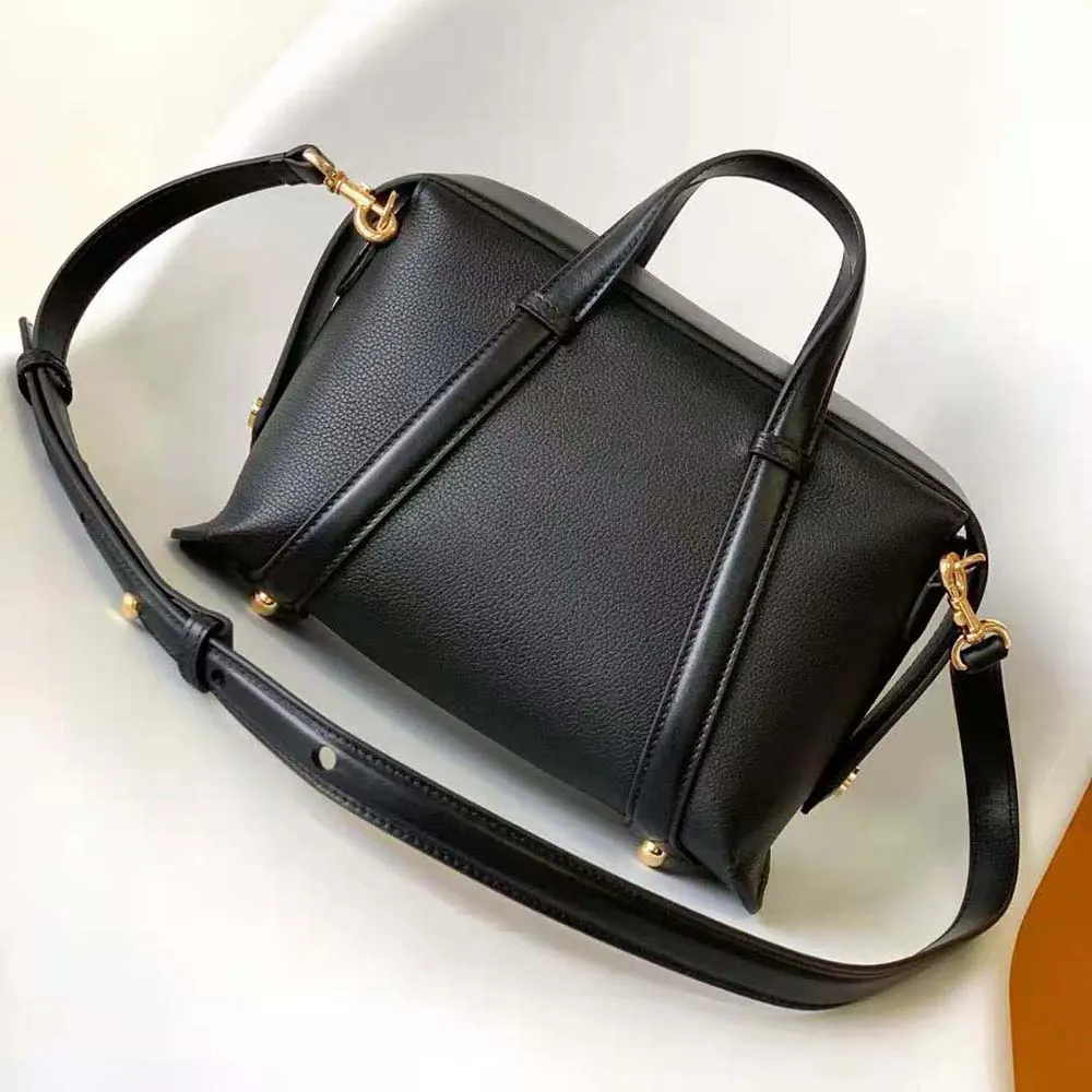 Side angle highlighting structured silhouette of Fendi Women Boston 365 Black Leather Bag