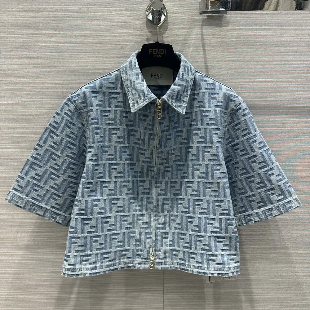 Close-up of silver buttons on Fendi Women Light Blue FF Denim Jacket