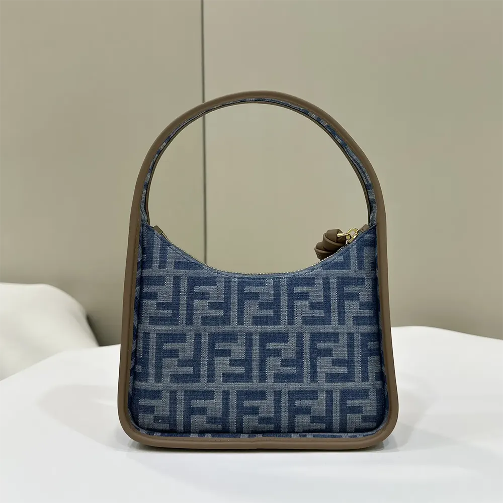 Close-up of gold FF logo hardware on denim mini bag