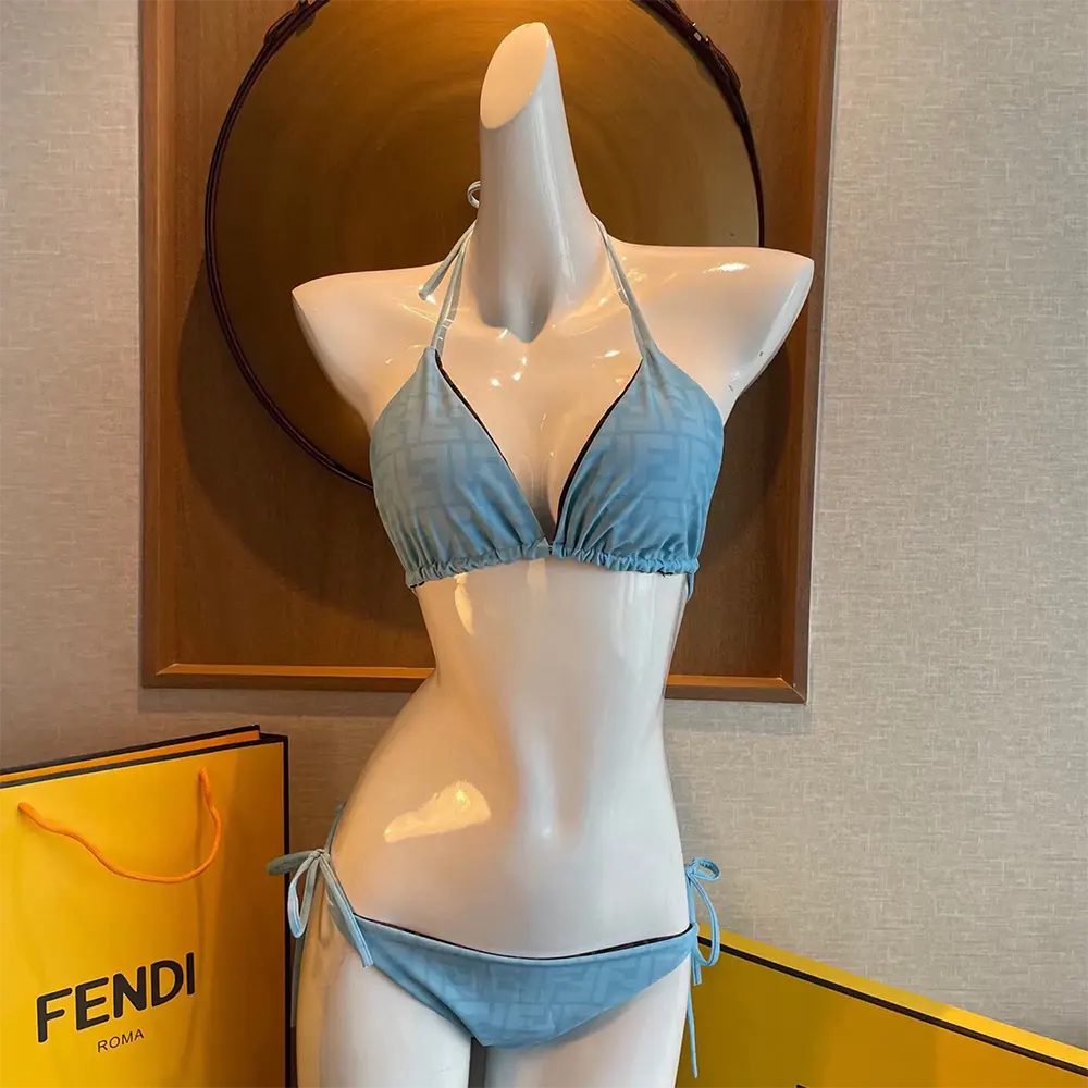 Close-up of clasp and Fendi logo on blue Lycra bikini