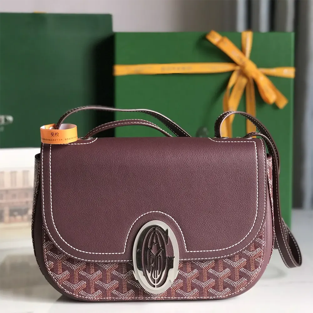Close-up of polished brass hardware on Goyard Unisex 233 Bag-Maroon