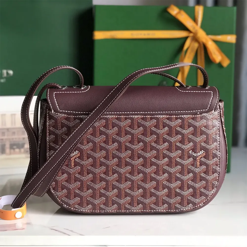 Side profile of maroon Goyard Unisex 233 Bag with leather trim details