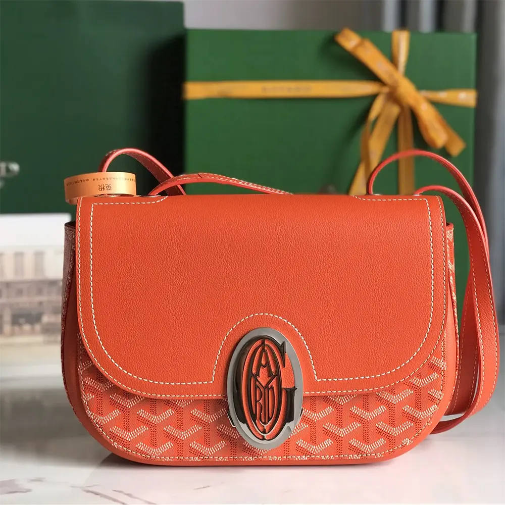 Close-up of Goyard Unisex 233 Bag-Orange signature chevron pattern