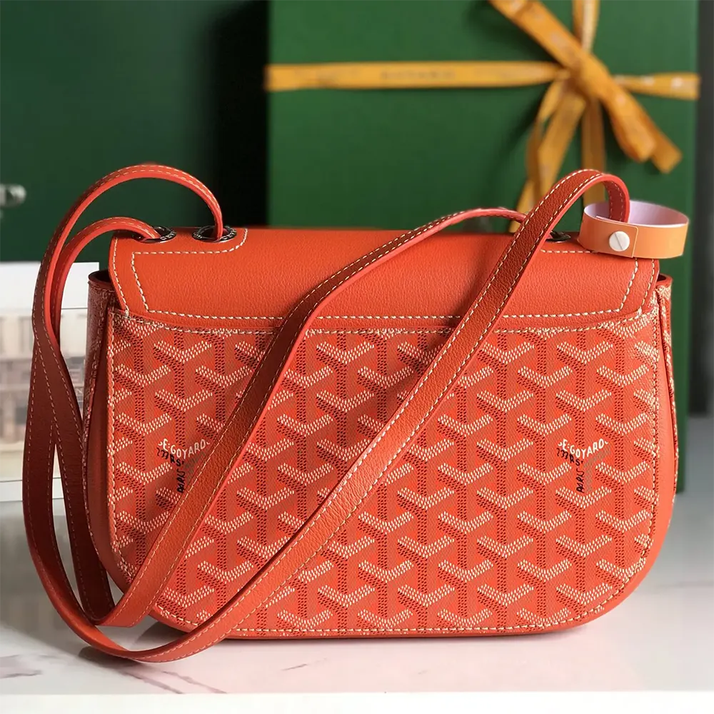 Side profile of Goyard Unisex 233 Bag-Orange with leather trim detail