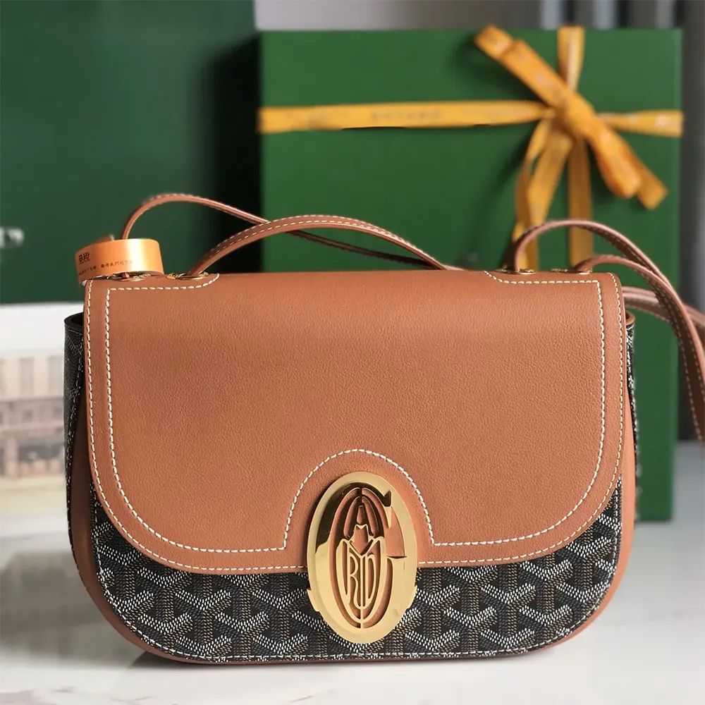 Close-up of tan leather trims and polished hardware on Goyard Unisex 233 Bag-Tan