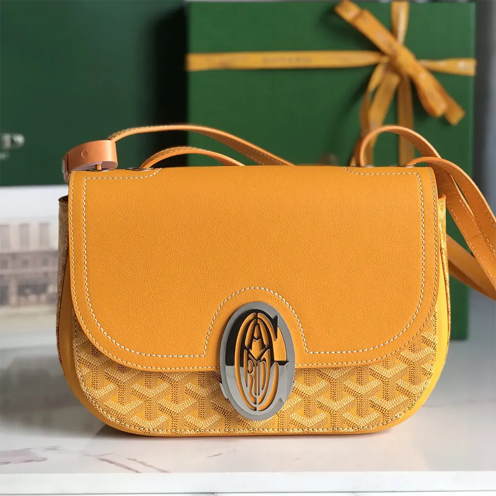 Close-up of yellow coated canvas and brass hardware on Goyard Unisex 233 Bag-Yellow