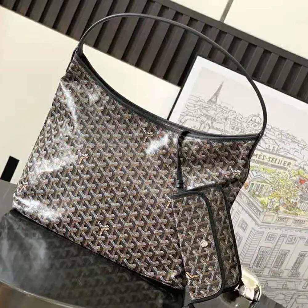Close-up detail of black leather and silver hardware on Goyard bag