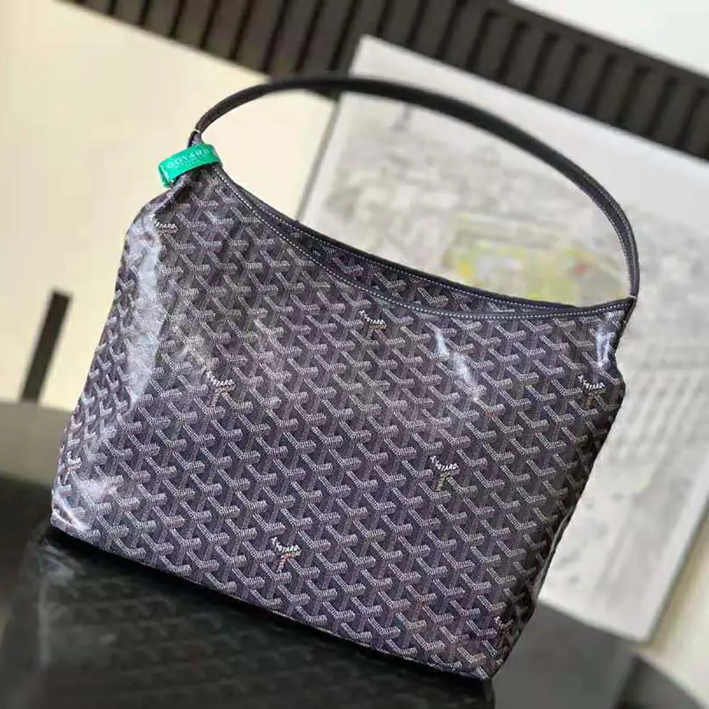 Side view highlighting adjustable strap and zip closure of Goyard Bohème Hobo Bag