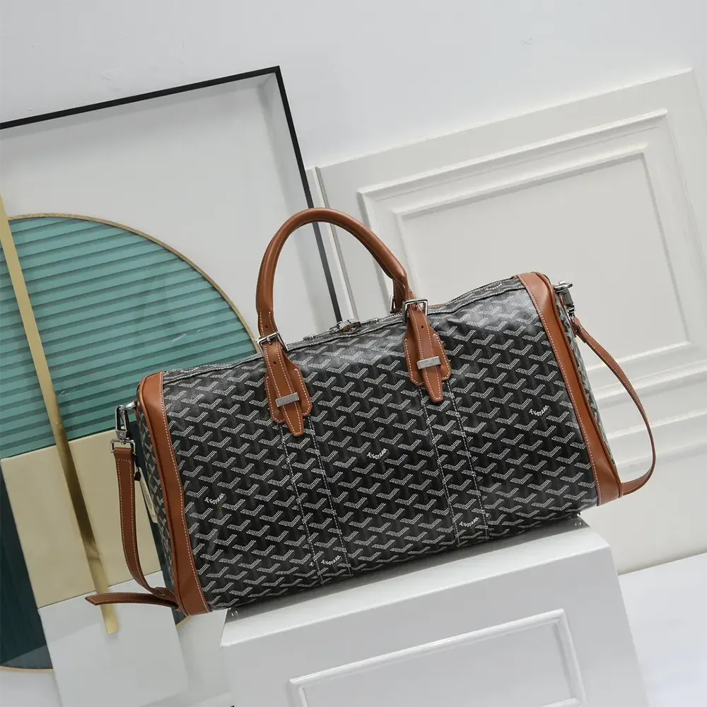 Close-up detail of leather trim and gold-tone hardware on Goyard Boston 50 Bag