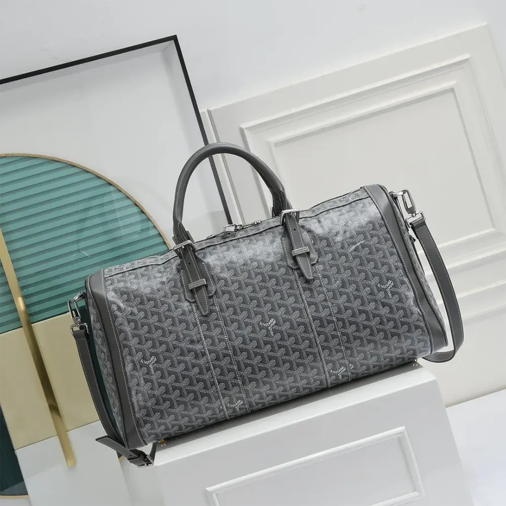 Close-up of brass hardware and leather trim on Goyard Unisex Boston 50 Bag-Grey