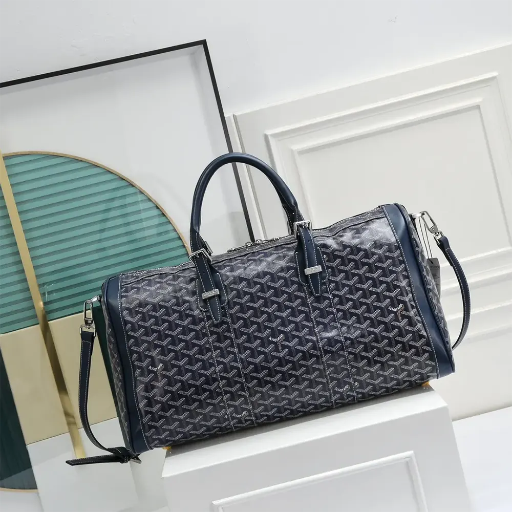Side angle showing gold-tone hardware on Goyard Boston 50 bag