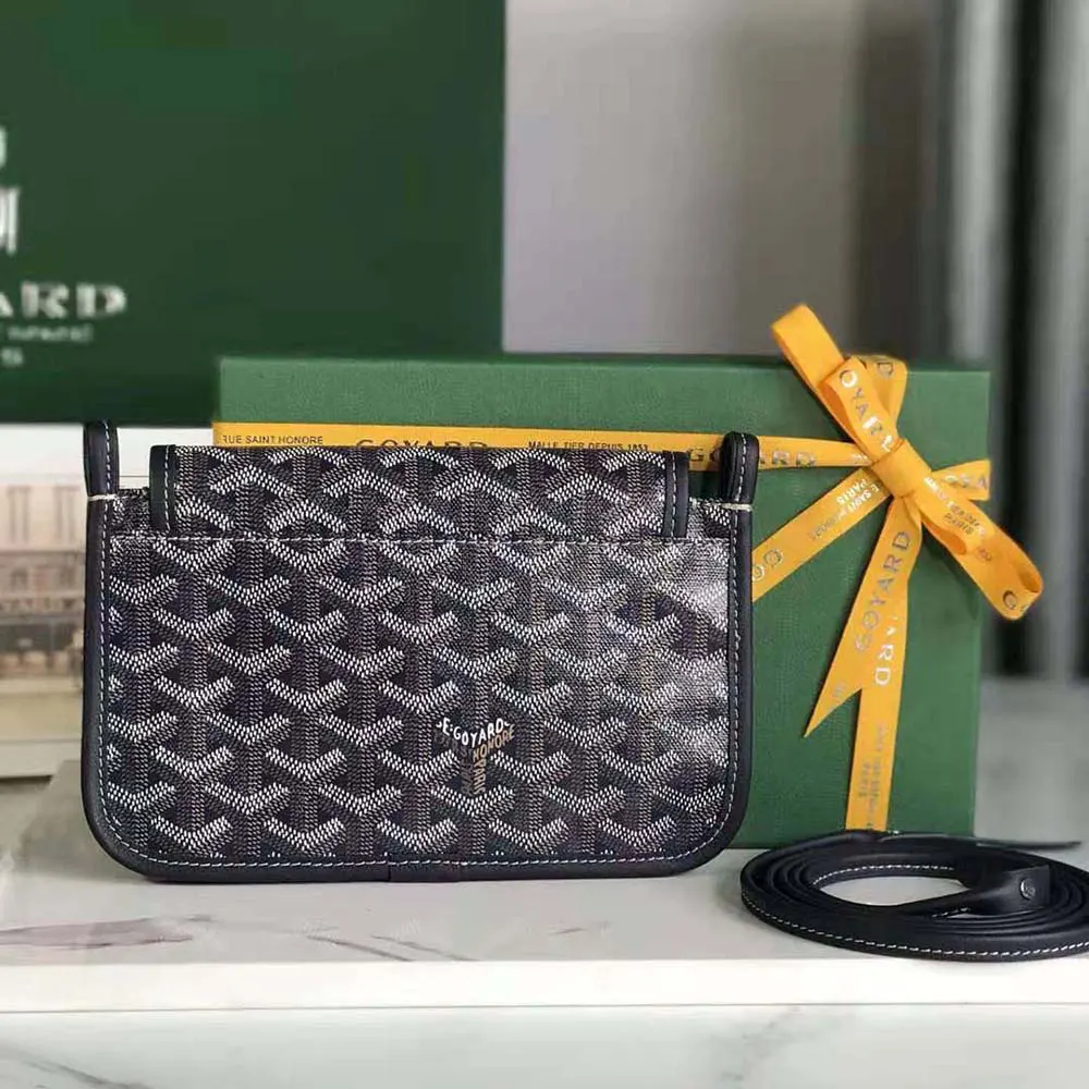 Side angle showing slim profile of Goyard Women Plumet Pocket Wallet-Navy