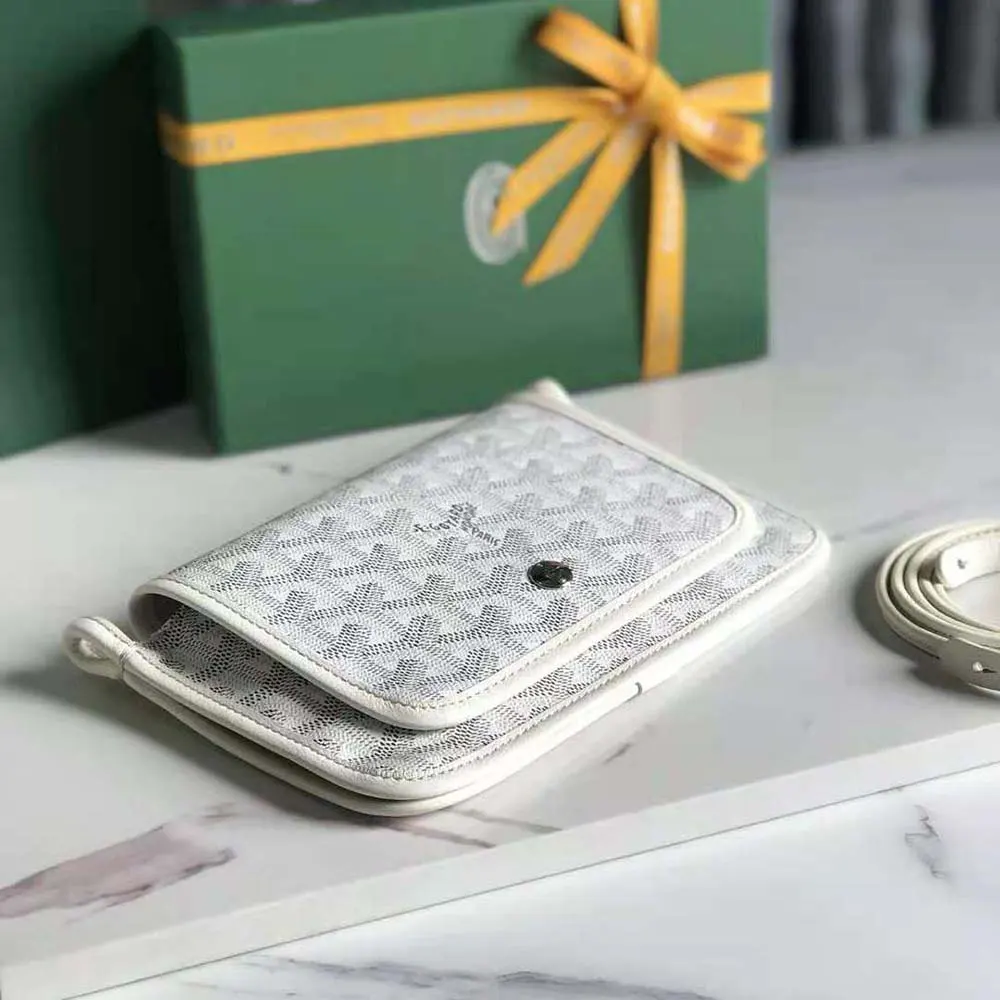 Side angle of white Goyard Women Plumet Pocket Wallet highlighting slim silhouette