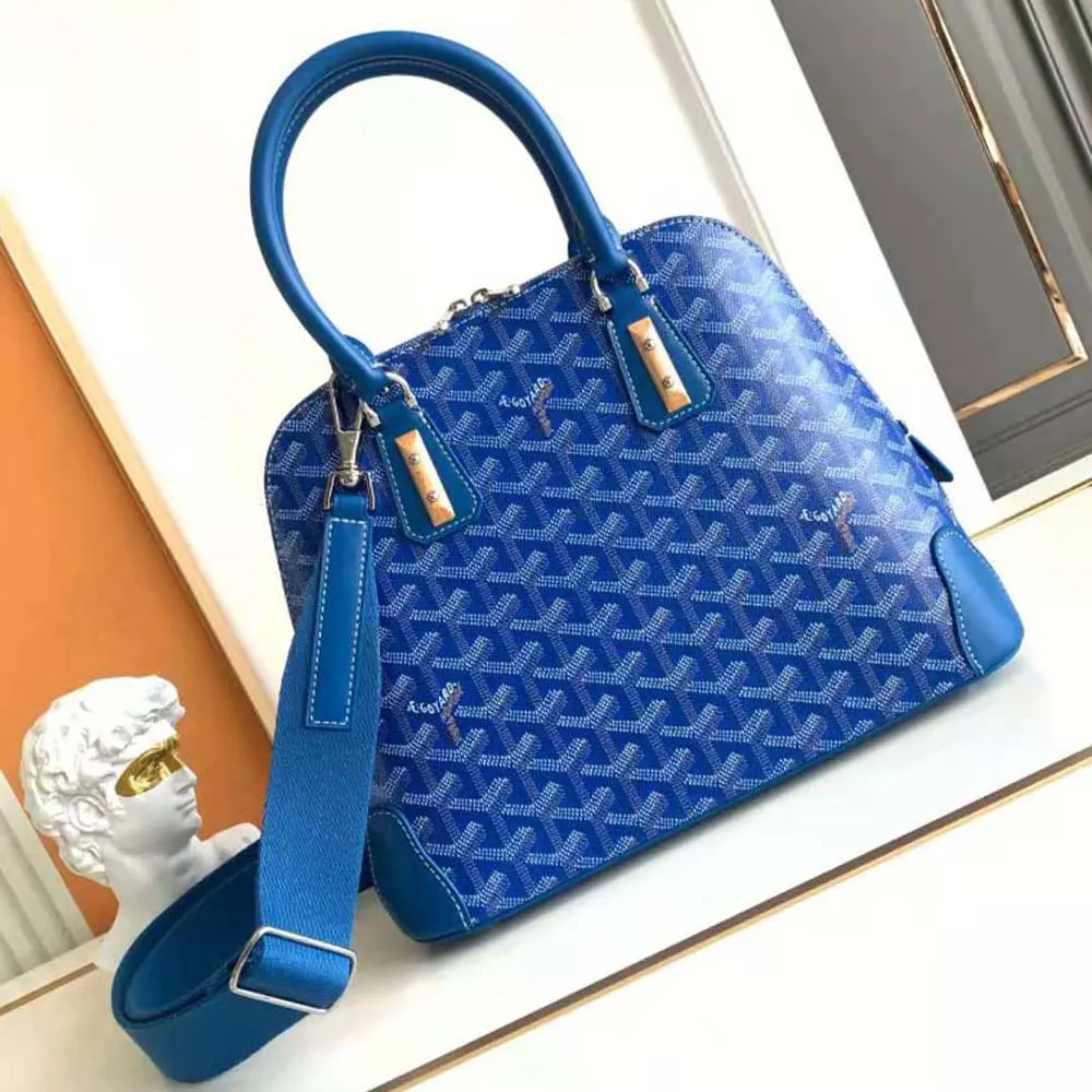 Close-up on blue coated canvas with gold hardware on Goyard Women Vendôme PM Bag-Blue
