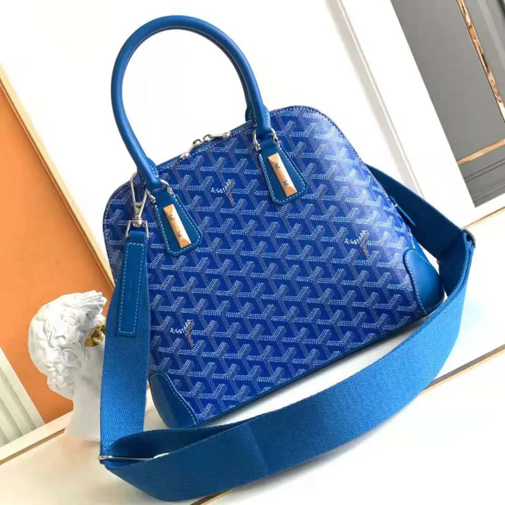 Side angle highlighting leather trim and adjustable strap of Goyard Women Vendôme PM Bag-Blue