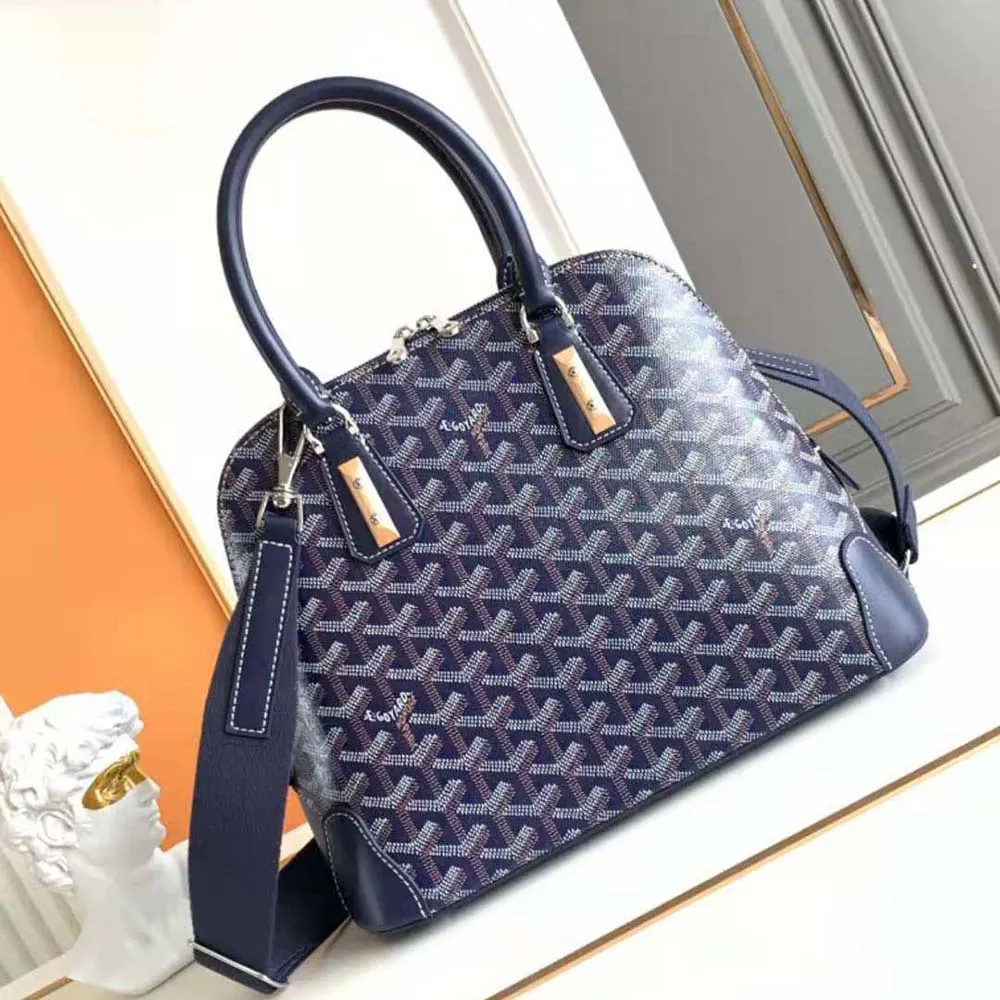 Close-up of silver hardware and navy chevron pattern on Vendôme PM Bag