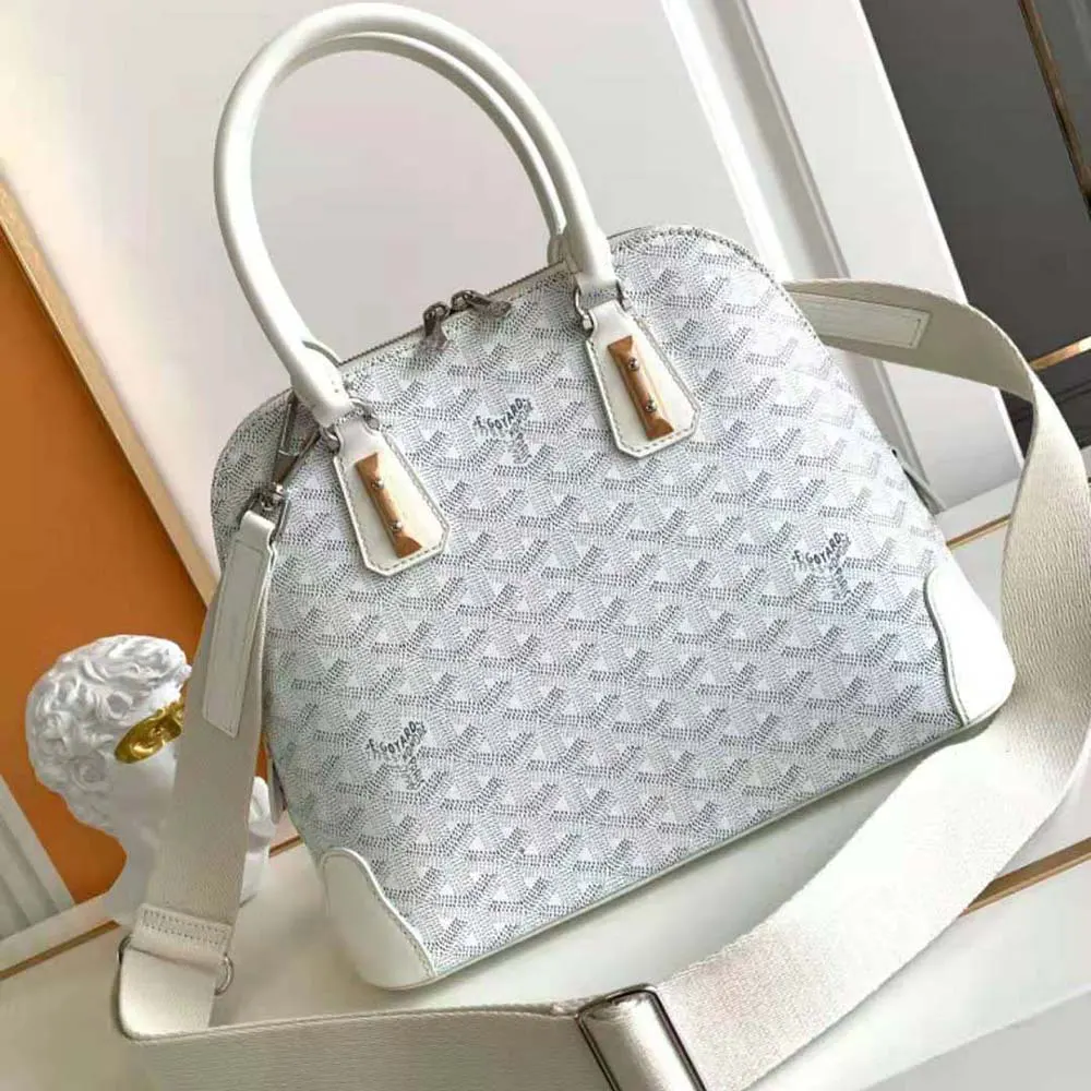 Close-up of gold-tone hardware and leather trim on Goyard Women Vendôme PM Bag-White