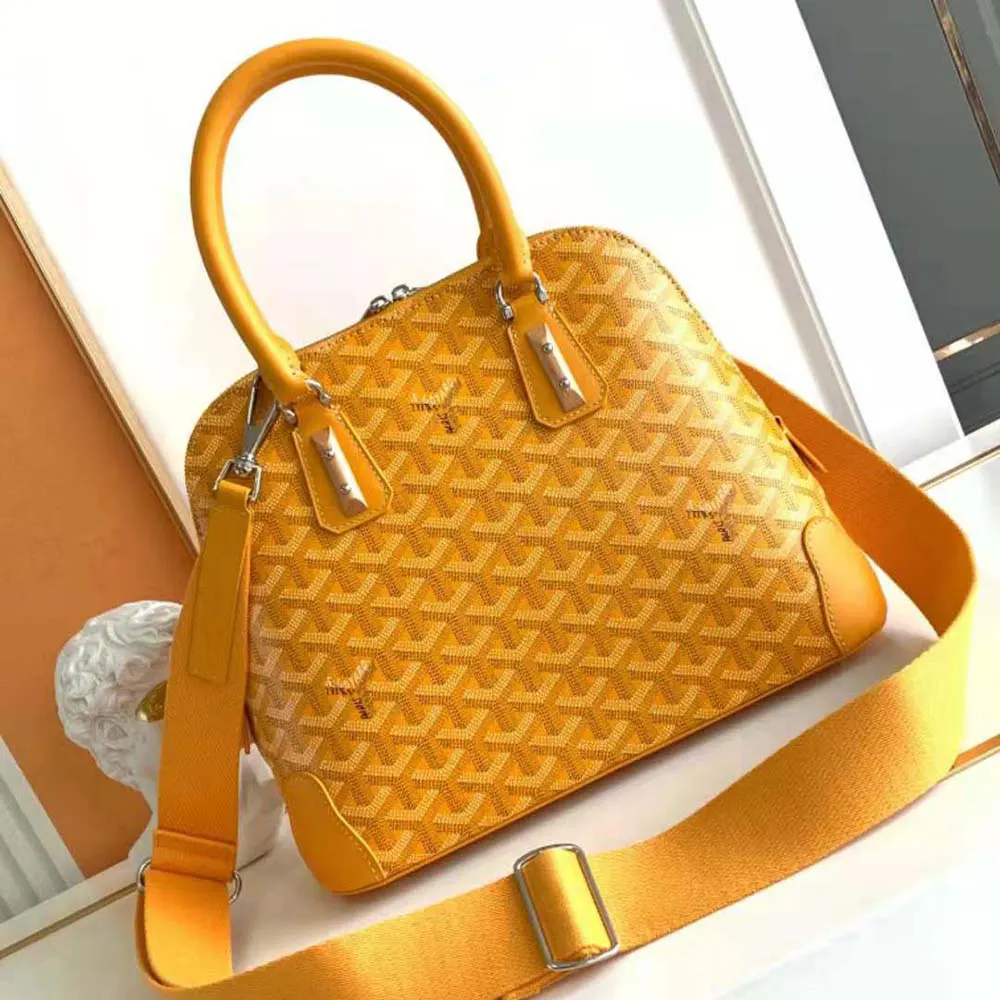 Close-up on gold hardware and signature chevron pattern, Vendôme PM Bag