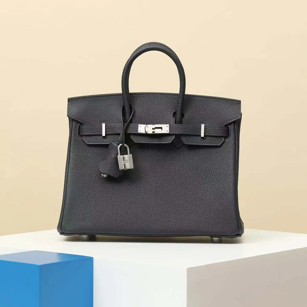 Close-up on silver hardware and textured black Epsom leather details