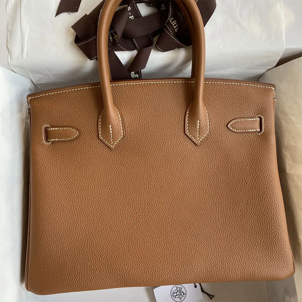 Side profile showing structured silhouette of Hermes Birkin 30 Bag brown
