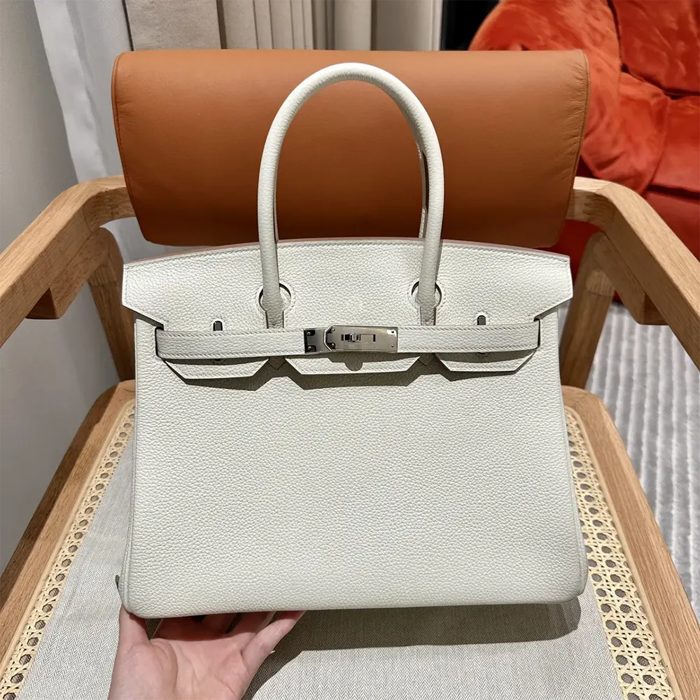 Side profile showing structured silhouette of Hermes Birkin 30 White handbag