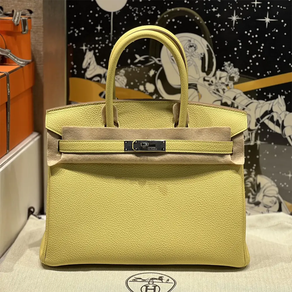 Side angle showing structured silhouette of Hermes Birkin 30 Bag in yellow