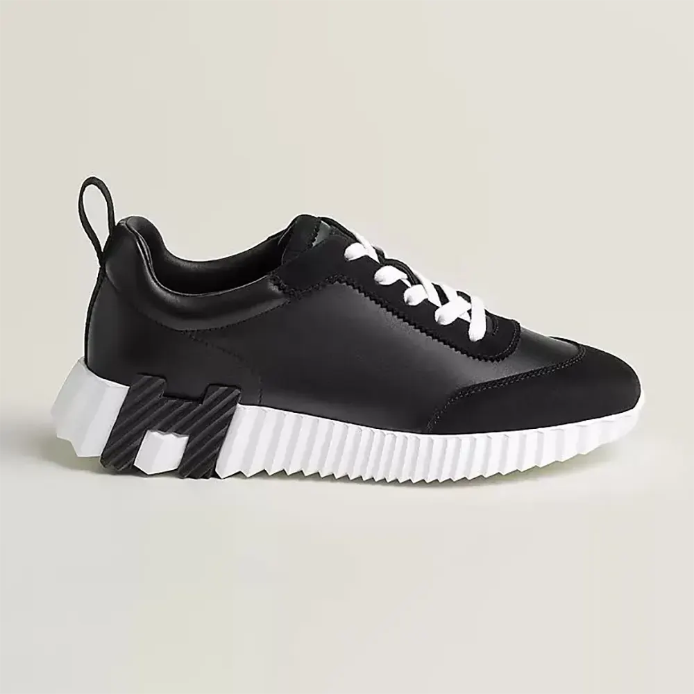 Side view of Hermes Unisex Bouncing Sneaker-Black H242250Z showing profile