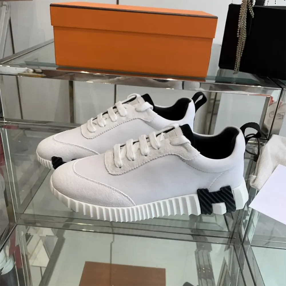 Top angle showing laces and black accents of Hermes Unisex Bouncing Sneaker