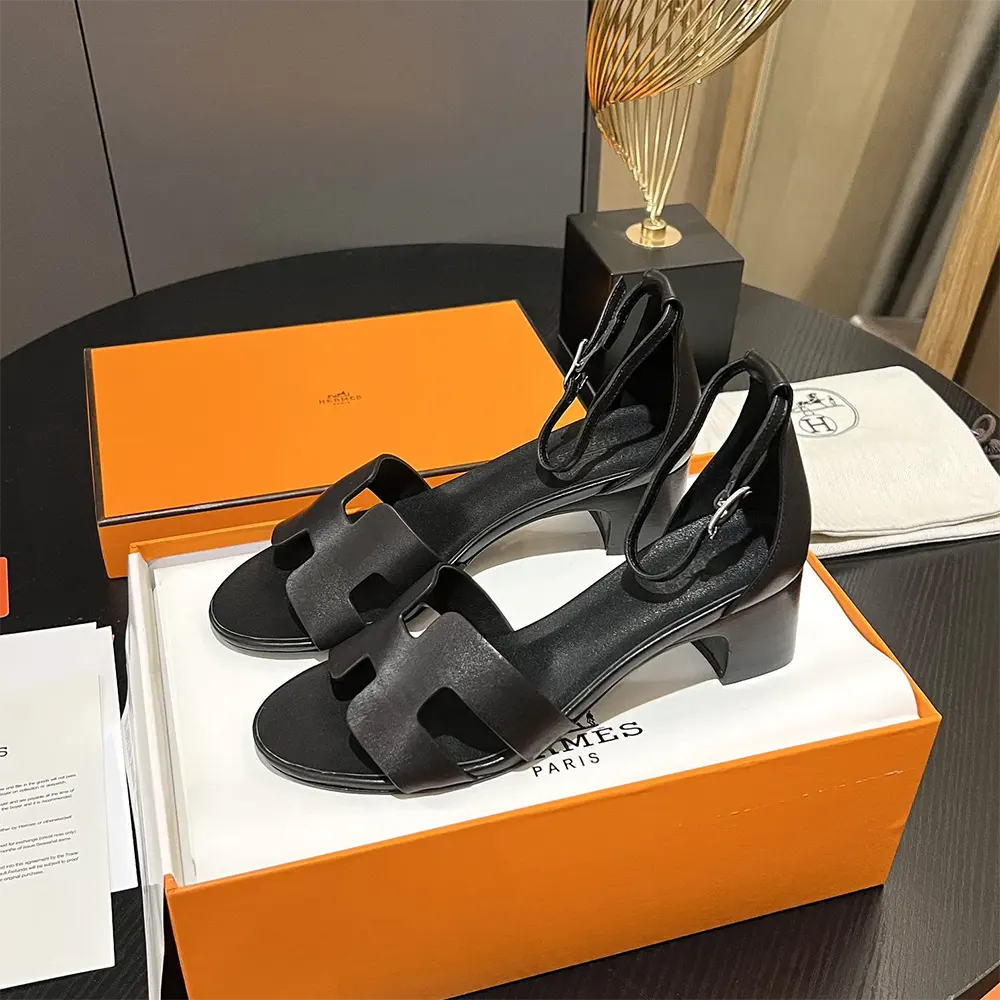 Top view highlighting the elegant silhouette of Hermes Women Encens 50 Sandal-Black