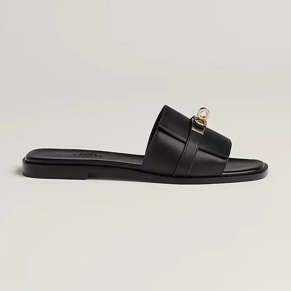 Side angle of Hermes Women Giulia Sandal-Black showcasing leather texture