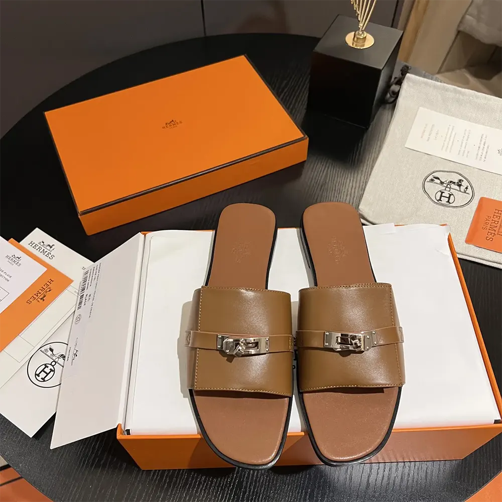 Close-up of rich brown calf leather on Hermes Women Giulia Sandal-Brown