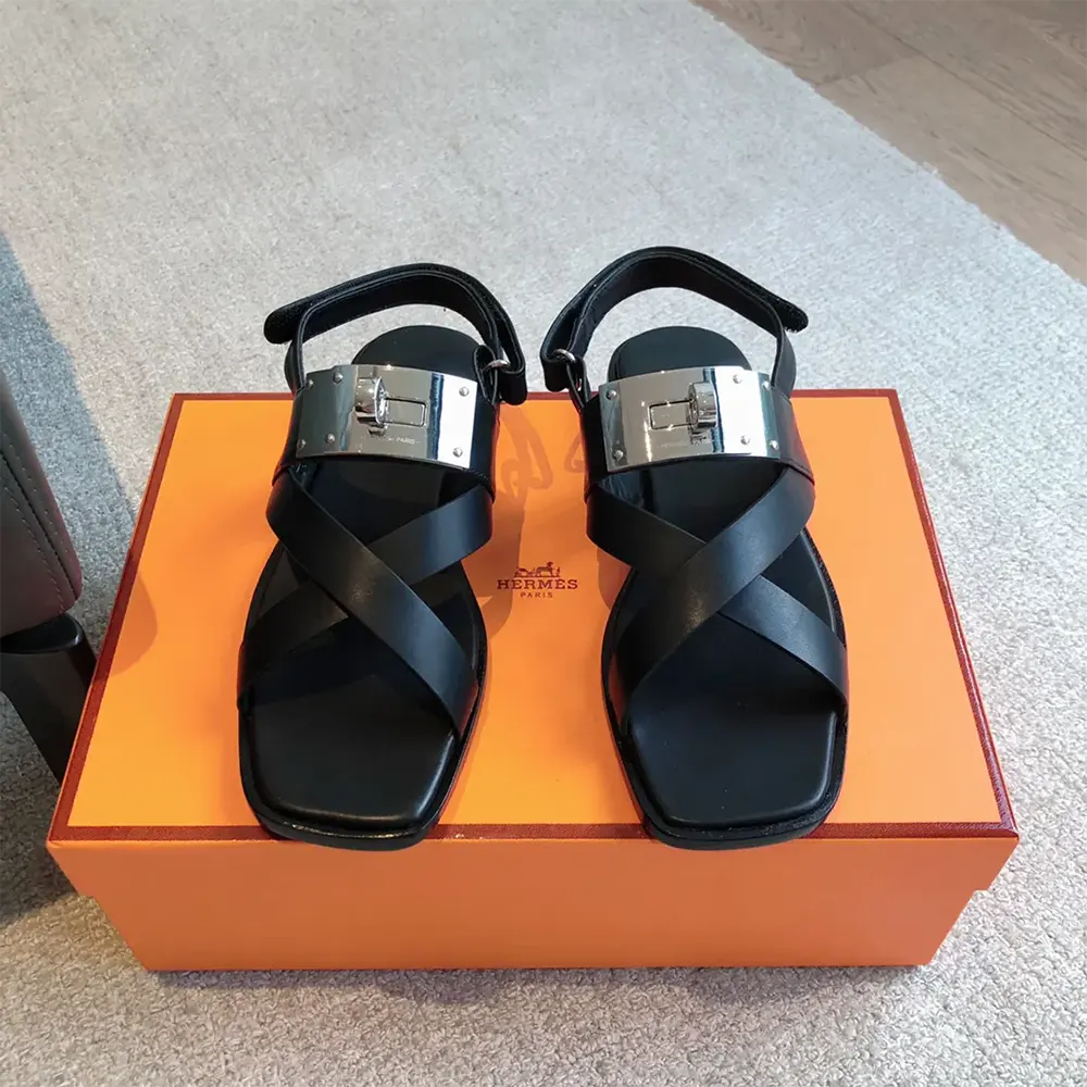 Top angle of Hermes Women Ines Sandal-Black highlighting buckle closure