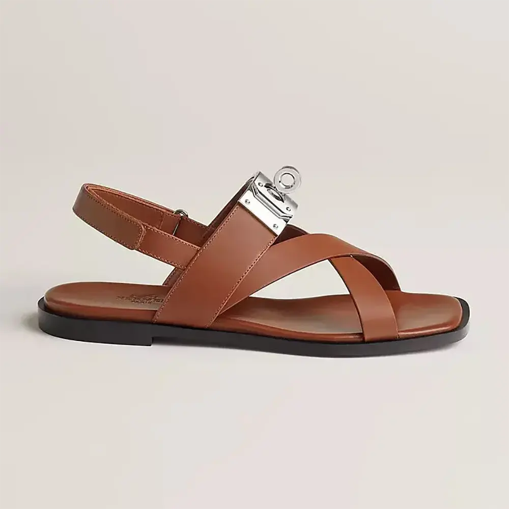 Side profile of Hermes Women Ines Sandal-Brown showing buckle detail