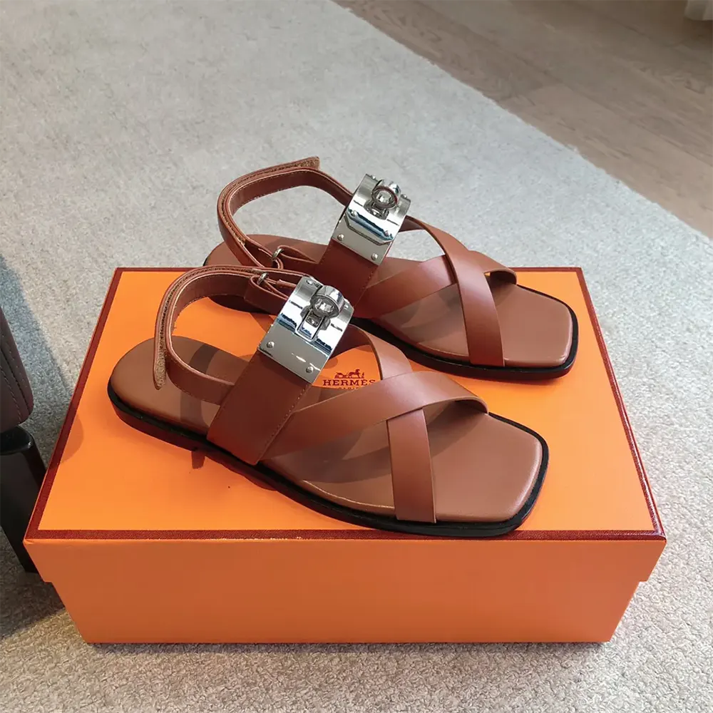 Close-up of brown leather and signature stitching on Hermes Women Ines Sandal-Brown