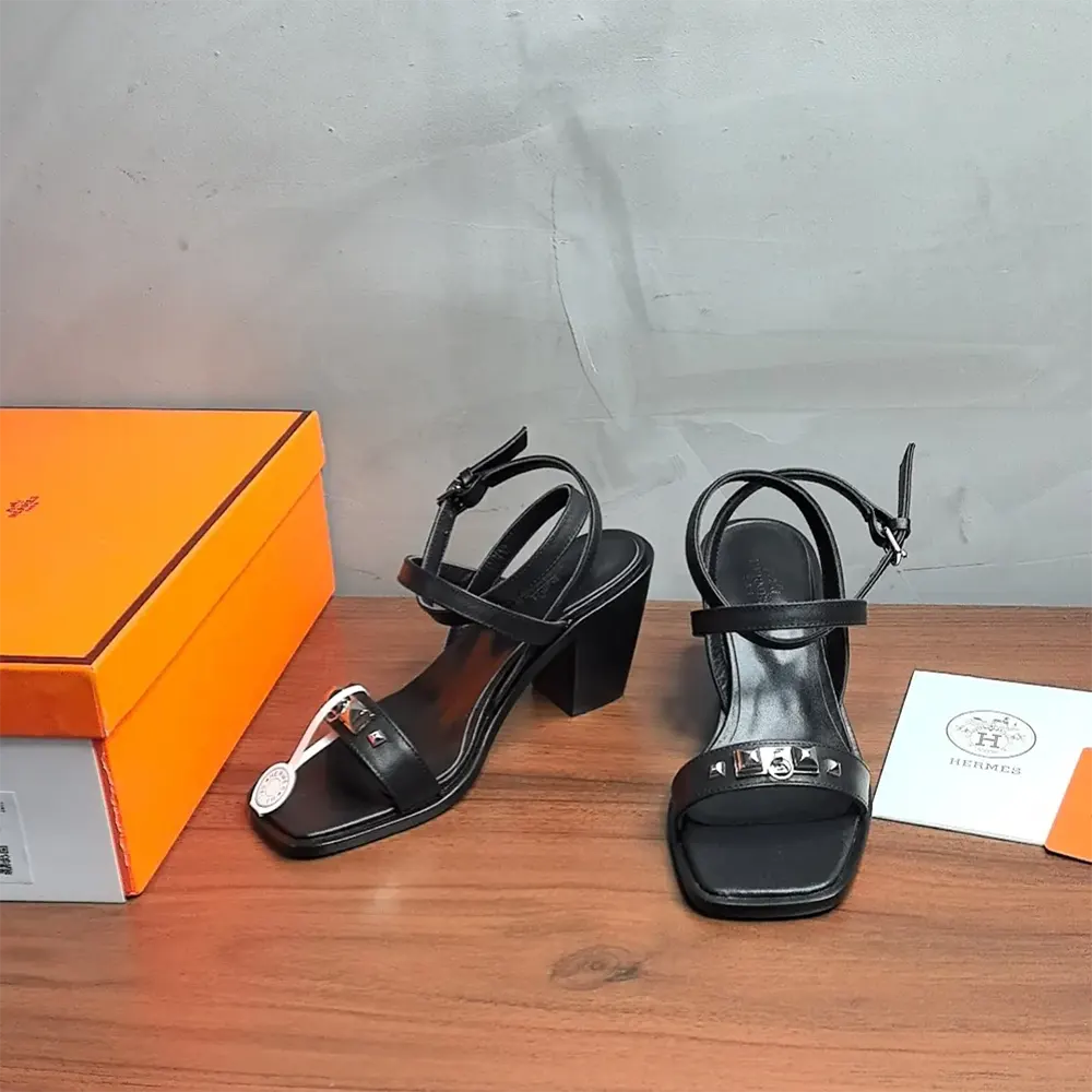 Front angle highlighting open toe of Hermes Women Ivresse 65 Sandal-Black