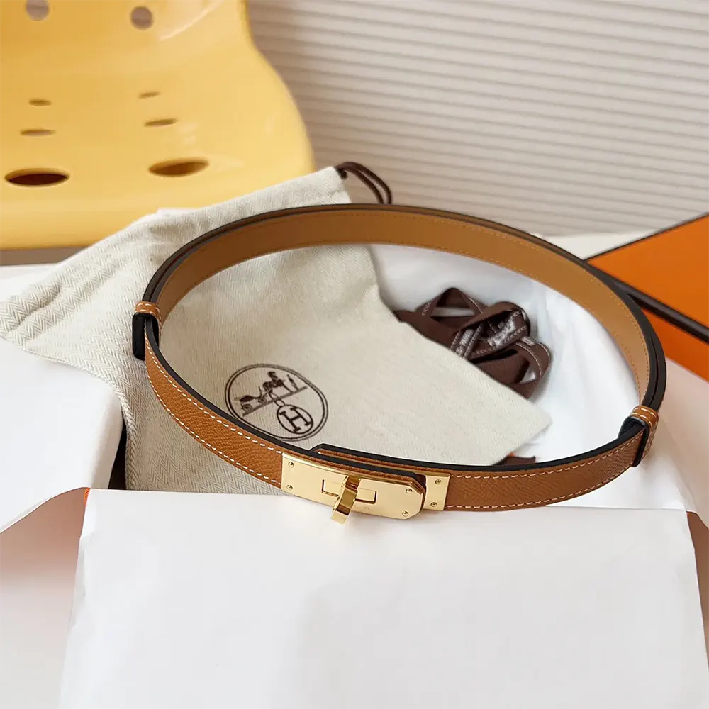Close-up of polished gold-tone H buckle on Hermes Women Kelly 18 Belt-Brown