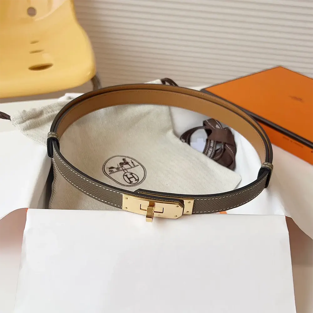 Close-up of polished silver H buckle on Hermes Women Kelly 18 Belt-Grey