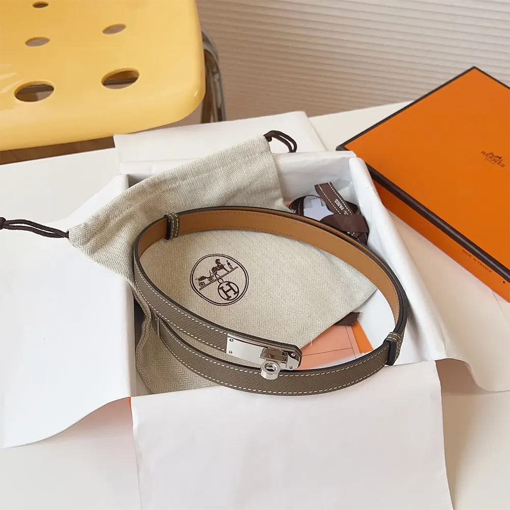 Side angle showcasing slim silhouette of Hermes Women Kelly 18 Belt-Grey