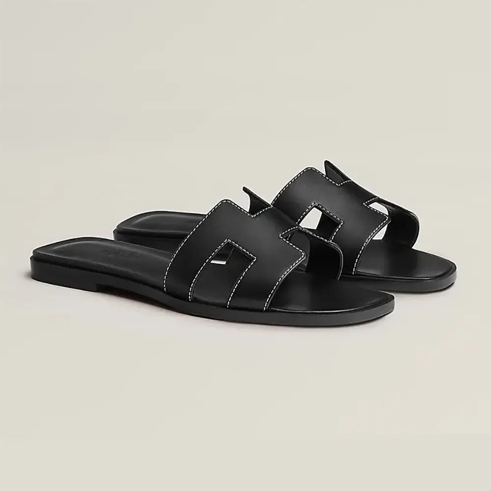 Front view of Hermes Women Oran Sandal-Black showing signature cutout