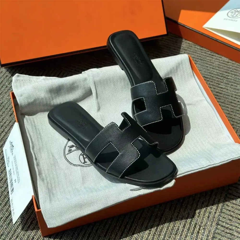 Close-up detail of smooth calfskin leather on Hermes Women Oran Sandal-Black