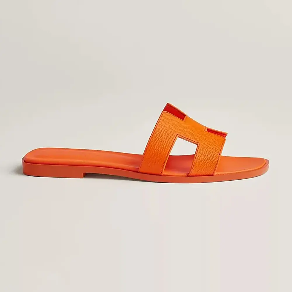 Side view of Hermes Women Oran Sandal-Orange showing profile silhouette